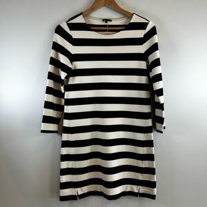 Darling knit THEORY Dress in light tan and black.Cute with tall boots! Size Med.